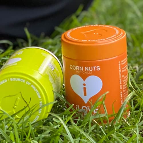 ILOVE Snacks corn nuts pictured in a reusable tin 